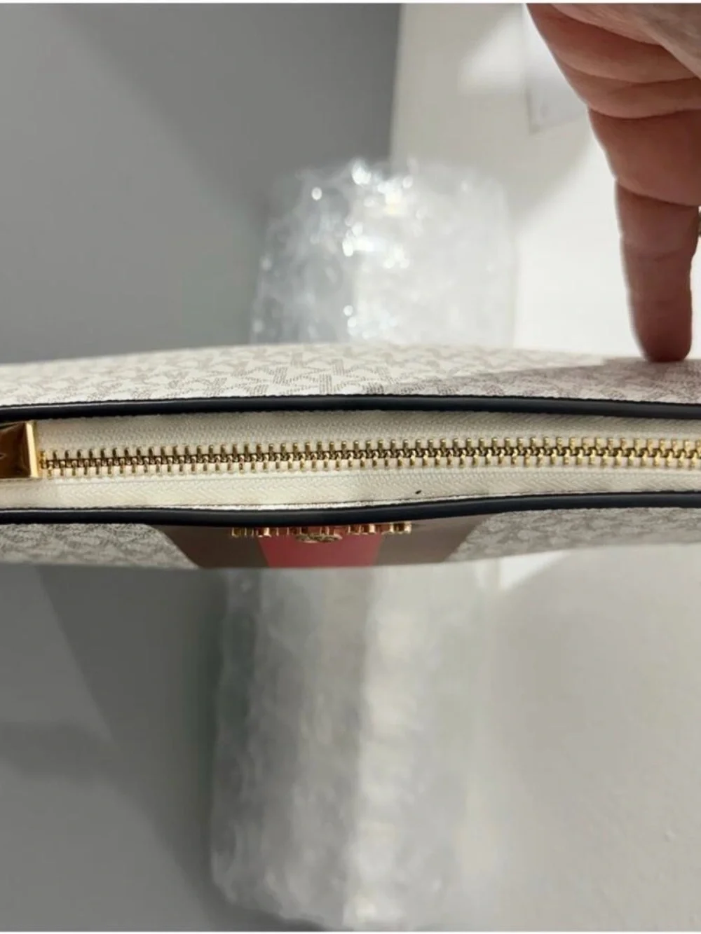 NWOT Michael Kors Beige Monogram Pouch Wrislet